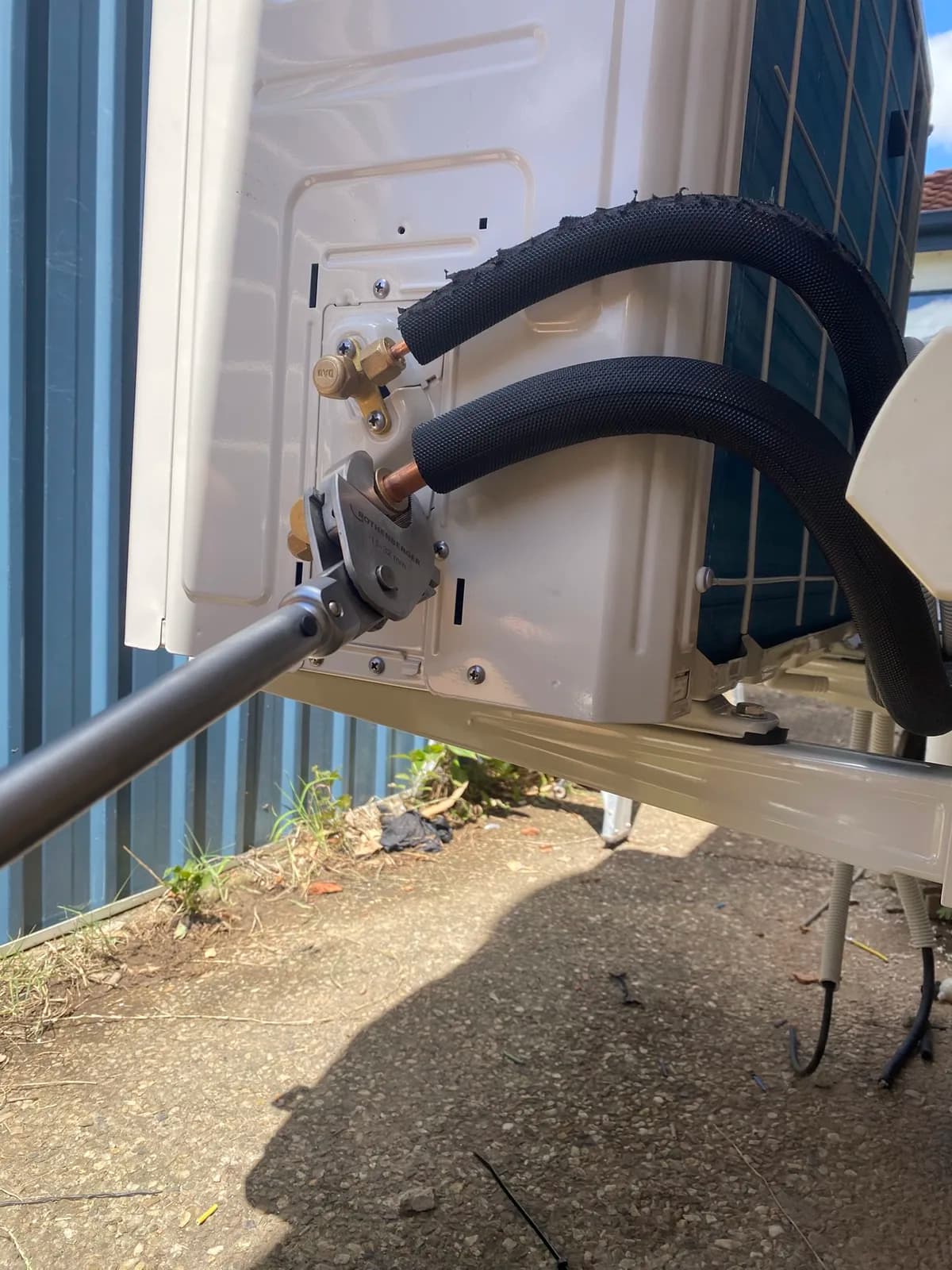 Insulated refrigeration pipes flared and connected to a new outdoor unit